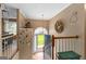 Bright foyer with staircase and decorative accents at 345 Wynbrook Dr, Mcdonough, GA 30253