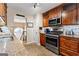 Kitchen with granite counters, stainless steel appliances, and wood cabinets at 345 Wynbrook Dr, Mcdonough, GA 30253