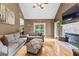 Cozy living area features hardwood floors, a fireplace, and plush seating at 345 Wynbrook Dr, Mcdonough, GA 30253