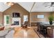Cozy living room with fireplace, wood floors, and open layout at 345 Wynbrook Dr, Mcdonough, GA 30253