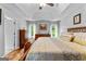 Cozy main bedroom with tray ceiling, hardwood floors, and bright windows at 345 Wynbrook Dr, Mcdonough, GA 30253
