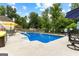 Backyard pool featuring a lounging area and fenced perimeter at 345 Wynbrook Dr, Mcdonough, GA 30253