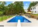 Private in-ground pool complete with diving board and outdoor seating area at 345 Wynbrook Dr, Mcdonough, GA 30253