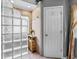 Bathroom features a tiled shower with glass block partition and stylish fixtures at 345 Wynbrook Dr, Mcdonough, GA 30253