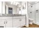 Well-lit bathroom boasts granite countertops, sleek fixtures, and a luxurious glass-enclosed shower at 503 Countryside Se Pl, Smyrna, GA 30080