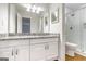 Bathroom boasts granite counters, updated lighting, and tiled walk-in shower at 503 Countryside Se Pl, Smyrna, GA 30080