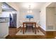 Dining room with hardwood floors, chandelier, and access to the kitchen, stainless steel appliances at 503 Countryside Se Pl, Smyrna, GA 30080