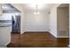 Dining room with hardwood floors and access to the kitchen featuring stainless steel appliances at 503 Countryside Se Pl, Smyrna, GA 30080