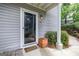 Inviting front porch with 'Welcome' mat, house number and side yard with privacy bushes at 503 Countryside Se Pl, Smyrna, GA 30080