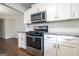 This bright kitchen features granite countertops, stainless steel appliances, and white cabinets at 503 Countryside Se Pl, Smyrna, GA 30080
