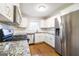 The updated kitchen has stainless steel appliances, granite counters, and ample cabinet space at 503 Countryside Se Pl, Smyrna, GA 30080