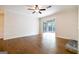 Empty living room featuring hardwood floors, a ceiling fan, and natural light at 503 Countryside Se Pl, Smyrna, GA 30080