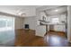 Cozy living room flows into kitchen featuring modern appliances and an abundance of natural light at 503 Countryside Se Pl, Smyrna, GA 30080