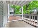 Cement patio with a white wood railing that overlooks a wooded area with other apartments at 503 Countryside Se Pl, Smyrna, GA 30080