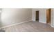 Spacious bedroom with hardwood style floors, neutral paint, and ensuite bath at 1392 Orchard Park Dr, Stone Mountain, GA 30083