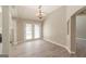 Inviting dining area featuring a modern chandelier and easy access to the back patio at 1392 Orchard Park Dr, Stone Mountain, GA 30083