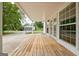 Relaxing back porch with wood floors offering an idyllic outdoor living space at 306 Tyrone Rd, Fayetteville, GA 30214