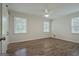 Clean, bright bedroom with hardwood floors, ceiling fan, and natural light at 306 Tyrone Rd, Fayetteville, GA 30214