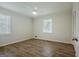 Bedroom boasts neutral walls, hardwood flooring, a ceiling fan and natural light at 306 Tyrone Rd, Fayetteville, GA 30214