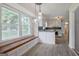 Bright dining area with a window bench and views of the updated kitchen at 306 Tyrone Rd, Fayetteville, GA 30214