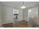 Dining room with wood floors and a view to the updated kitchen at 306 Tyrone Rd, Fayetteville, GA 30214