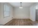 Inviting dining room with natural light and wood-look flooring at 306 Tyrone Rd, Fayetteville, GA 30214