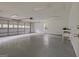 Garage interior with open garage door, gray floor, and storage shelves at 306 Tyrone Rd, Fayetteville, GA 30214