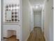 Hallway view showcasing the bathroom with granite counters and modern finishes at 306 Tyrone Rd, Fayetteville, GA 30214