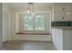 Bright kitchen nook with window seat, pendant lighting, and modern finishes at 306 Tyrone Rd, Fayetteville, GA 30214