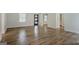 Bright living room with wood floors, a large window, and neutral paint at 306 Tyrone Rd, Fayetteville, GA 30214