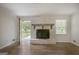 Bright living room with fireplace and access to outdoor deck at 306 Tyrone Rd, Fayetteville, GA 30214