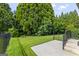 A spacious backyard features a patio and manicured lawn, perfect for outdoor enjoyment and relaxation at 545 Grand Teton Cir, Fayetteville, GA 30215