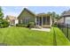 Expansive green backyard showcases mature landscaping and a charming screened-in porch at 545 Grand Teton Cir, Fayetteville, GA 30215