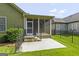 Backyard patio with access to the screened-in porch is ideal for outdoor relaxation and entertaining at 545 Grand Teton Cir, Fayetteville, GA 30215