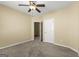 Bedroom with a ceiling fan, an open doorway, and neutral-toned walls offering a cozy space at 545 Grand Teton Cir, Fayetteville, GA 30215