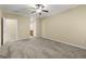 Inviting bedroom featuring soft carpeting, ceiling fan, access to an en-suite bathroom for added convenience, and neutral decor at 545 Grand Teton Cir, Fayetteville, GA 30215