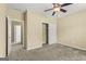 Bedroom with a ceiling fan, an open doorway, and a closet providing a bright and airy feel at 545 Grand Teton Cir, Fayetteville, GA 30215