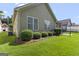 Exterior showcasing lush green lawn and mature landscaping that enhances curb appeal at 545 Grand Teton Cir, Fayetteville, GA 30215