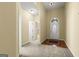 Spacious foyer with carpet, hardwood accents, and view of a bright interior at 545 Grand Teton Cir, Fayetteville, GA 30215