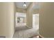 Hallway leading to a living area with neutral-toned walls, carpeted floors, and recessed lighting at 545 Grand Teton Cir, Fayetteville, GA 30215