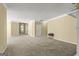 Spacious living room with neutral carpeting that flows into other areas creating a bright and welcoming environment at 545 Grand Teton Cir, Fayetteville, GA 30215