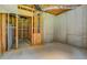 Unfinished basement space with block walls, exposed beams and an unfinished closet area at 235 Rustic Mill Ln, Fayetteville, GA 30214