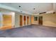 Basement featuring a bar area, built-in shelves, and open layout at 235 Rustic Mill Ln, Fayetteville, GA 30214