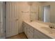 Bathroom vanity featuring double sinks, ample counter space, and gold hardware at 235 Rustic Mill Ln, Fayetteville, GA 30214