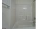 A standard, plain white tub with a shower head at 235 Rustic Mill Ln, Fayetteville, GA 30214
