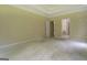 Bright bedroom with neutral walls, large windows, and access to multiple entryways at 235 Rustic Mill Ln, Fayetteville, GA 30214