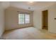 Bright bedroom featuring a window that provides natural light and a closet for storage at 235 Rustic Mill Ln, Fayetteville, GA 30214