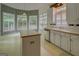 Bright breakfast nook featuring large windows and stylish striped wallpaper at 235 Rustic Mill Ln, Fayetteville, GA 30214