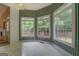 Bright breakfast nook with large windows offering serene views of the backyard at 235 Rustic Mill Ln, Fayetteville, GA 30214
