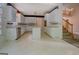 Spacious kitchen with ample cabinet space and a center island, perfect for meal preparation and entertaining at 235 Rustic Mill Ln, Fayetteville, GA 30214
